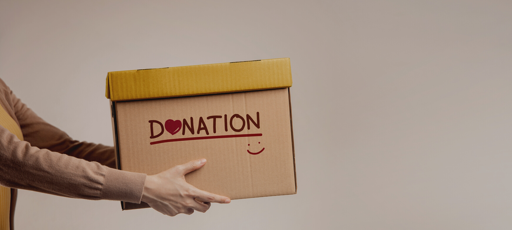 Donation Concept. Woman Giving Box of Donate with Donation